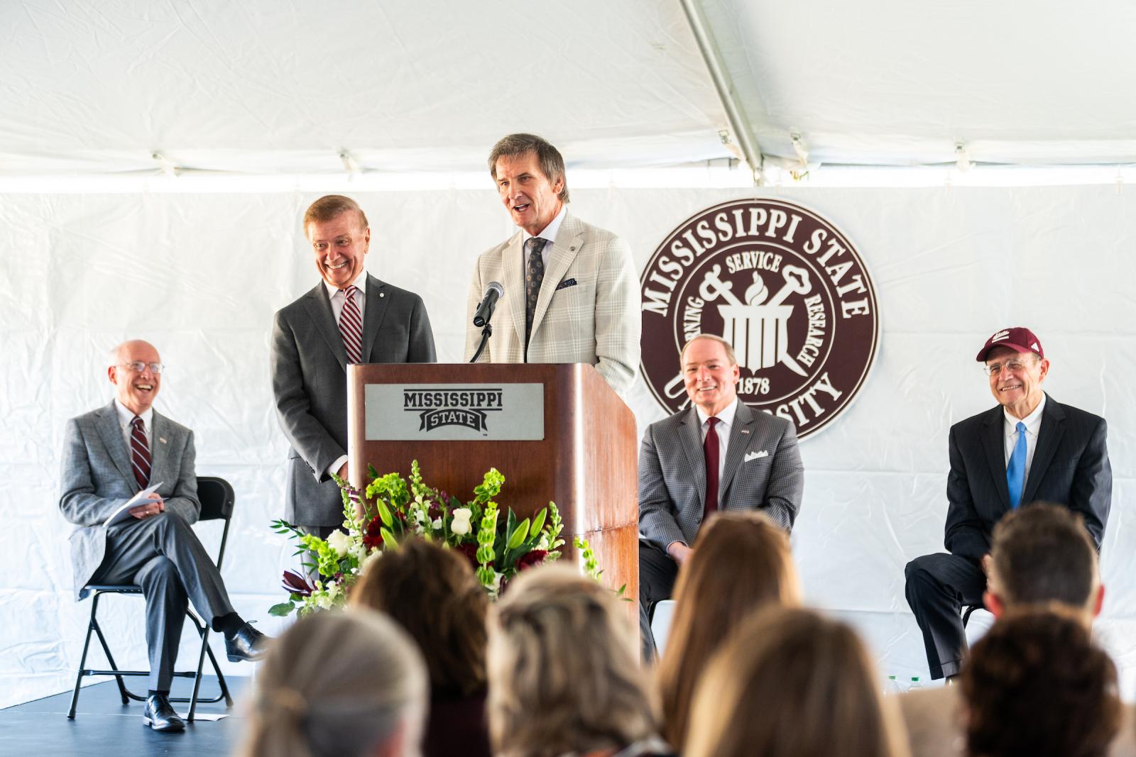 The Duff brothers speak to a crowd during the dedication of the Duff Center.