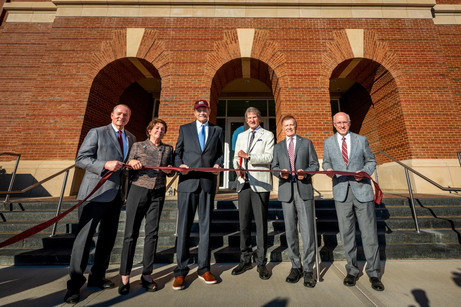University leaders and donors cut the ribbon of the new Duff Center