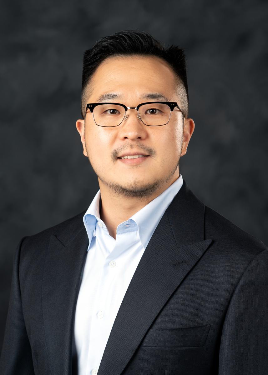 Male - wearing blue shirt with jacket